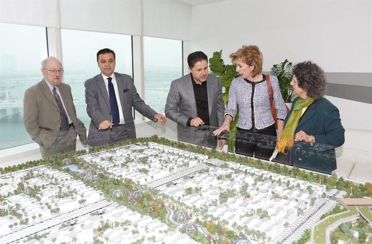 Diamond Developers point out features in the model of the Sustainable City.